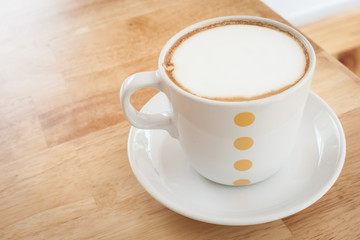 capucino coffee on wood table