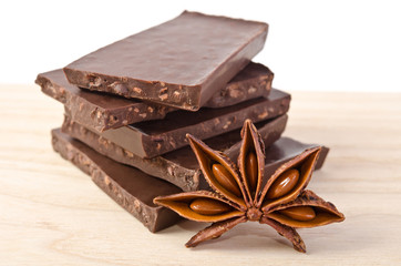 star of anise  and chocolate  on wooden table