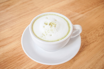 green tea latte on wood table