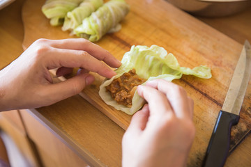 Processing to make a meat wrap in cabbage