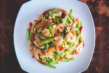 Stir-fry prawn with bean on square white plate