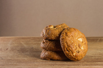 Oatmeal cookies with wooden background.