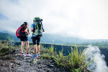 man and woman together on top of the hill