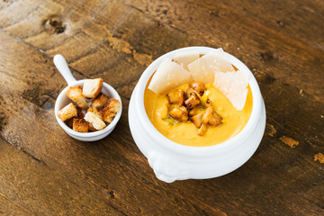 Pumpkin soup with chanterelles, parmesan and croutons.