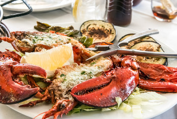 Grilled lobster on the sliced vegetables with cracker