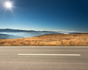 Side view of empty highway in mountain range