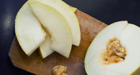 sections of an melon on cutting board 2