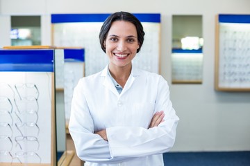 A female optician arm crossed
