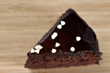 Chocolate soft cake on wood plate