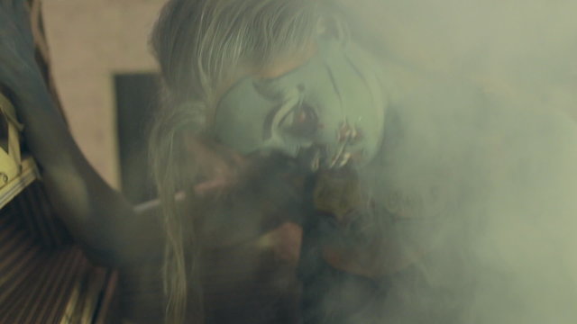 Halloween celebrating dressed as zombies in smoke
