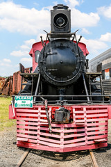 Obraz premium Red Cow Catcher on Old Black Locomotive