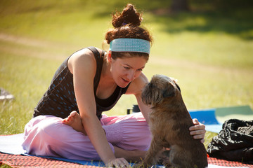 Yoga girl with her dog
