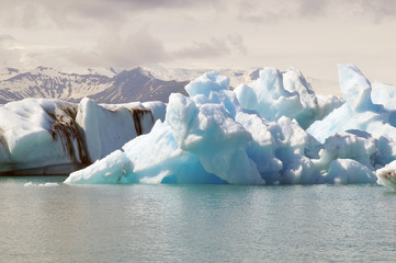 Ice lagoon with icebergs near glacier, icelandic landscape, southern Iceland