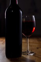 Glass of Red Wine and Bottle