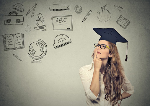 Business Woman With Graduation Hat Looking Up Thinking About Education