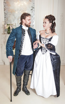 Beautiful couple woman and man in medieval clothes