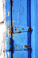 rusty metal    stripped paint in   door and morocco knocker