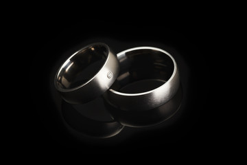 Wedding rings on black background