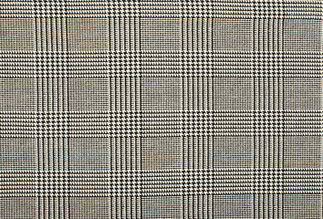 Black and white houndstooth pattern in squares. Black and white wool twill pattern. Woven dogstooth...