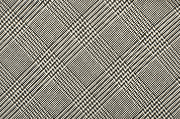 Black and white houndstooth pattern in squares. Black and white wool twill pattern. Woven dogstooth check design as background. - 90619571
