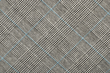 Black and white with blue houndstooth pattern in squares. Black and white wool twill pattern. Woven...