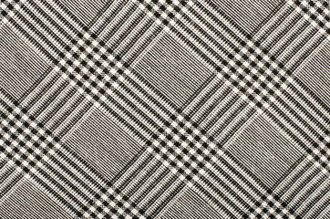 Black and white houndstooth pattern in squares. Black and white wool twill pattern. Woven dogstooth...