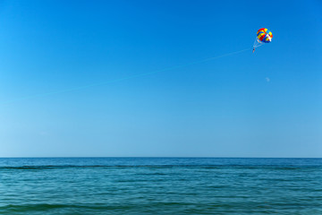 parasailing over the seasea, sky, activity, blue, parachute, peo