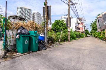 Fototapeta na wymiar Outdoor trashcans near street in city.