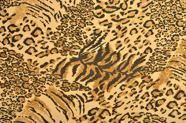 Brown and black leopard and tiger fur pattern. Spotted and striped animal print as background.