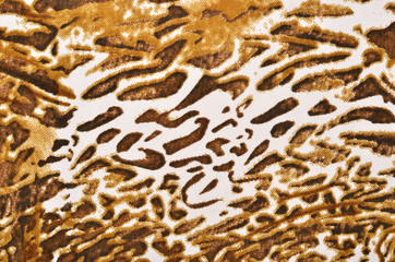 Brown leopard fur pattern. Spotted animal print as background.