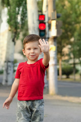 Fototapeta premium Happy child making a stop sign