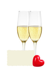 Two glasses of champagne, greeting card and red heart isolated