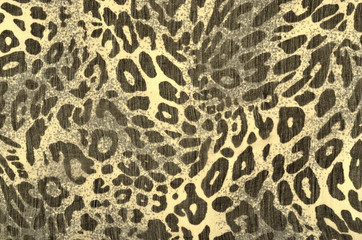 Black and yellow leopard fur pattern. Spotted animal print as background.