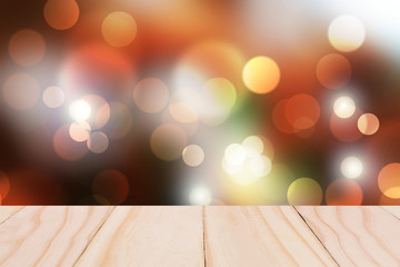 Wooden table and Bokeh light background.