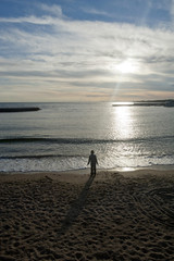 walking alone on the beach