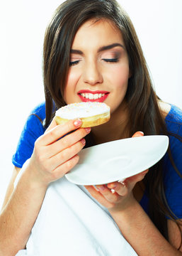 Young woman hold plate with donut.