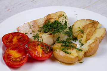 Fish Fillets with Herbs, Crispy Potatoes and  Roasted Tomatoes