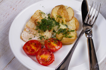 Fish Fillets with Herbs, Crispy Potatoes and  Roasted Tomatoes