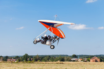 The motorized hang glider over the ground