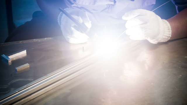 Welding man, welds  tube