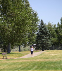 Mature female taking her morning walk outside.