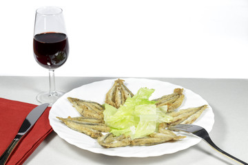 Mediterranean anchovies with salad and Rioja wineglass