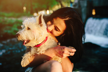 girl playing with a dog