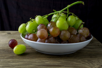 fresh raw grape on wooden table