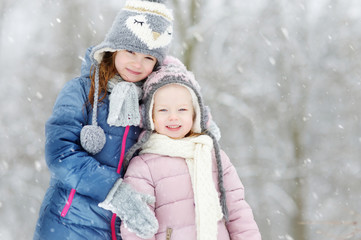 Two funny adorable little sisters winter park