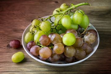 fresh raw grape on wooden table