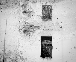 Abandoned building in Serbia war zone with bullet holes and destruction