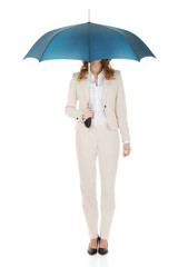 Businesswoman holding an umbrella.