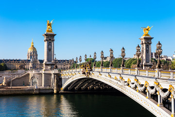 Fototapeta na wymiar Pont Alexandre III Bridge with Dome des Invalides, Paris