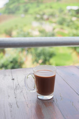 hot chocolate cup with nature background